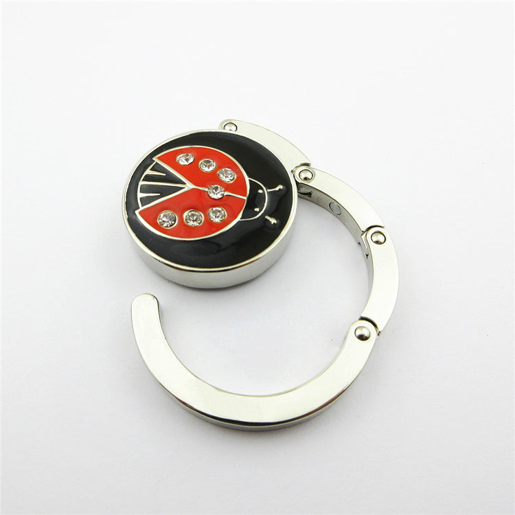 Custom Creative Table Top Folding Purse Hook Handbag Holder Accessories Metal Bag Hanger